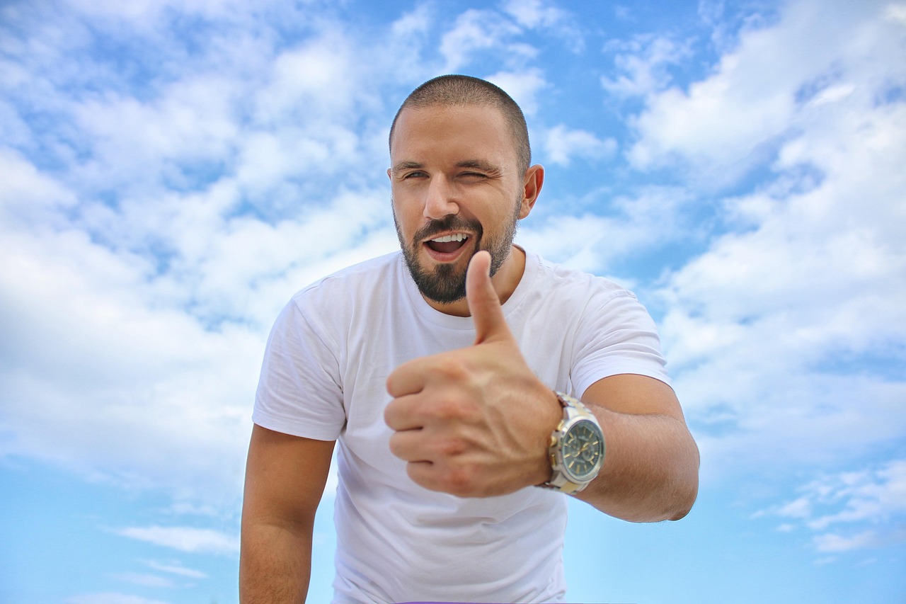 young man, blue sky, thumbs up, luxury watch, success, white shirt, beard, blue watch, thumbs up, thumbs up, thumbs up, thumbs up, thumbs up, success